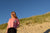 HEL T-Shirt Boxy fit in Pink mit Brusttasche am Strand von Sylt 